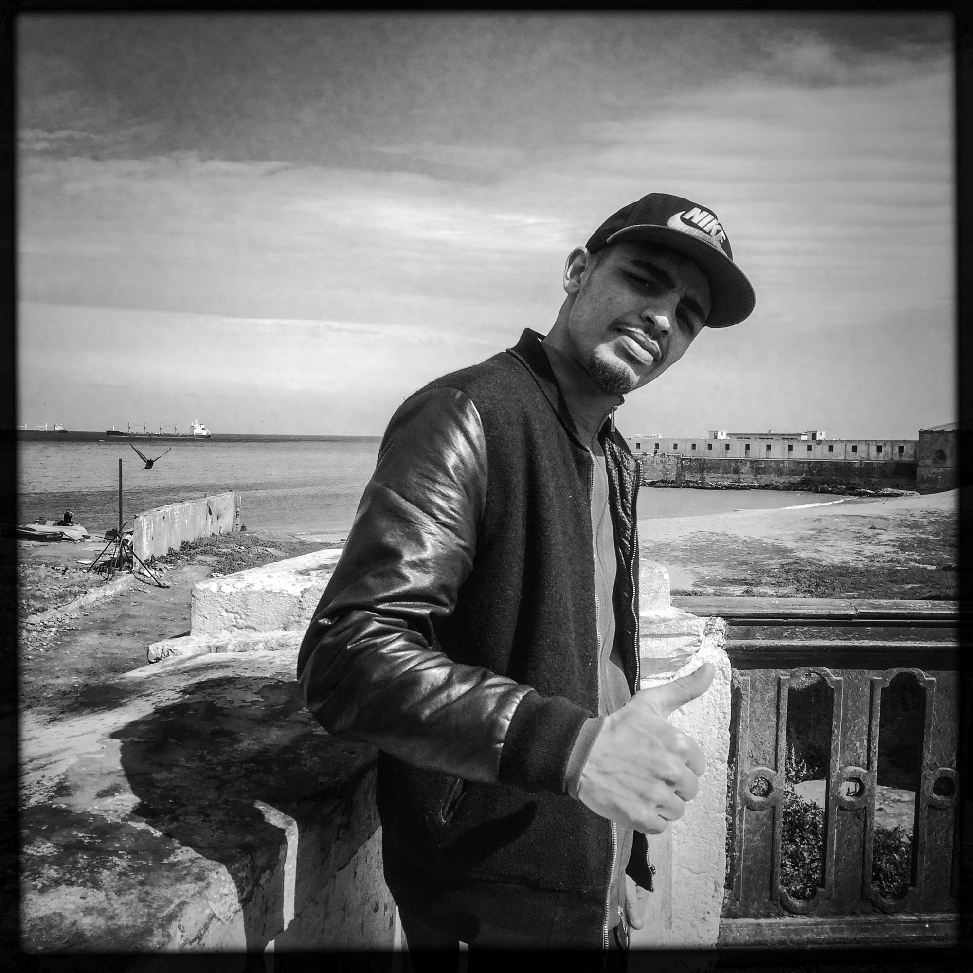 Youcef, young Algerian by the sea near Bab's district el Oued. 18 february, Alger-Algérie Youcef, jeune Algérien en bord de mer près du quartier de Bab el Oued. 18/ février 2016, Alger-Algérie